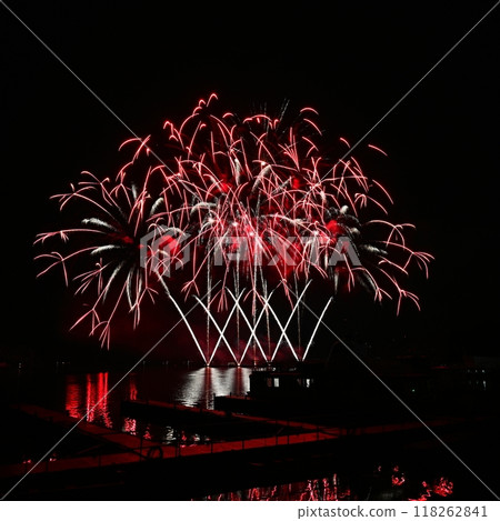 Firework. Beautiful colorful fireworks on the water surface with a clean black background. Fun festival and contest of Firefighters. Brno Dam - Czech Republic. Firework. Beautiful colorful fireworks on the water surface with a clean black background. Fun festival and contest of Firefighters. Brno Dam - Czech Republic. 118262841