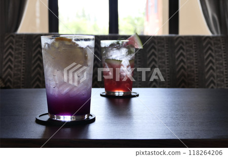 Lemon and blueberry soda in a glass of ice. Lemon and blueberry soda in a glass of ice. 118264206