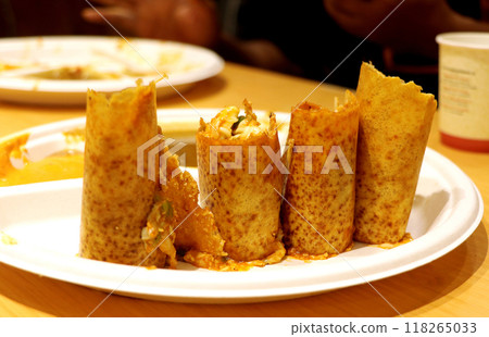 Plate full of delicious Indian pizza Dosa wraps with sambhar and chutney sauces at vrindavan Plate full of delicious Indian pizza Dosa wraps with sambhar and chutney sauces at vrindavan 118265033