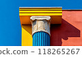 Colorful Architectural Elements. Blue Greek Column, Yellow and Red Wall Against Clear Blue Sky 118265267