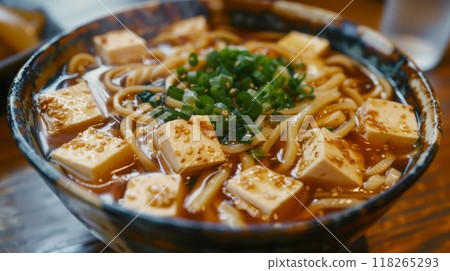 Japanese miso udon noodle with tofu in bowl on wooden table Japanese miso udon noodle with tofu in bowl on wooden table 118265293
