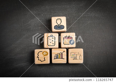 Management concept. Wooden blocks on a black chalkboard background 118265747
