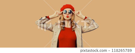 Autumn portrait beautiful young woman blowing a kiss in red french beret hat, stylish girl posing 118265789
