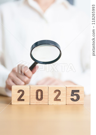 Happy New Year 2025 with magnifying glass and people. hiring, employee, recruitment, job, SEO and jobless concept 118265993