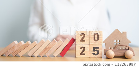 2025 year with wood block falling to business icon with Home and Car model. Real estate Mortgage, House loan and Car debt, Interest rate, risk management, Insurance and economic recession 118265997