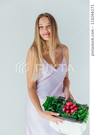 Beautiful blonde woman and bag with vegetables 118266171