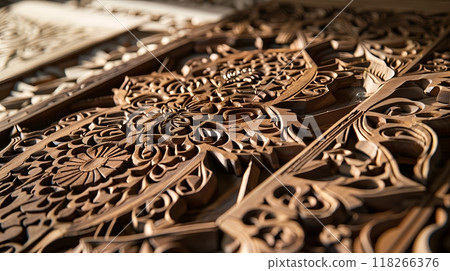 Close-up of intricately carved wooden panels showcases expert craftsmanship and detailed artistry. 118266376