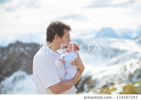 Family with kids hiking in the mountains Family with kids hiking in the mountains 118267203