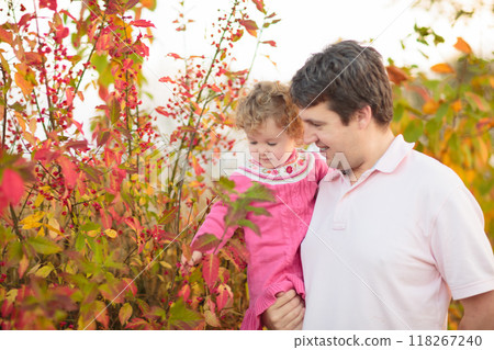 Father and baby in autumn. Fall outdoor family fun. Father and baby in autumn. Fall outdoor family fun. 118267240