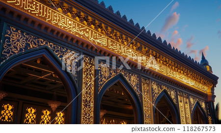 A beaded Islamic entablature with exquisite calligraphy and arabesque work, glowing in twilight. 118267573