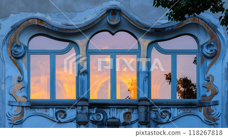 An Art Nouveau entablature with whimsical curves and organic forms creates a serene, enchanting atmosphere. 118267818