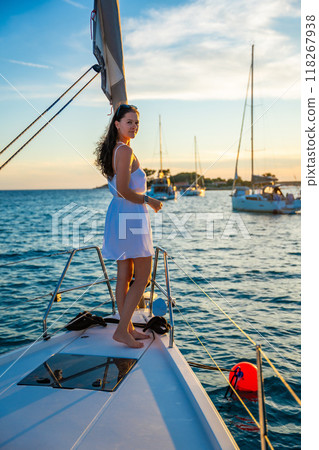 Young woman sailing, young adult lady enjoying summer travel, close-up portrait of female face, summer cruise holidays, European girl tourist traveling in sail boat in Croatia Young woman sailing, young adult lady enjoying summer travel, close-up portrait of female face, summer cruise holidays, European girl tourist traveling in sail boat in Croatia 118267938