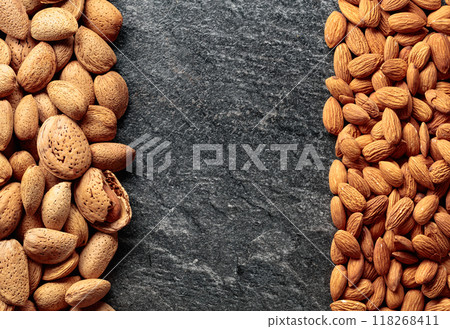 Almonds on a stone background. Almonds on a stone background. 118268411