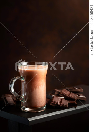 Pieces of bitter chocolate and glass of cocoa drink. 118268421