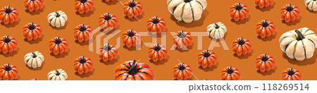 Horizontal banner with pumpkin pattern on orange background. Minimal autumn, Halloween concept Horizontal banner with pumpkin pattern on orange background. Minimal autumn, Halloween concept 118269514