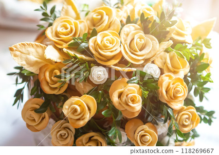 Beautiful Arrangement of Yellow Flowers in a Decorative Pot on a Sunny Table. Beautiful Arrangement of Yellow Flowers in a Decorative Pot on a Sunny Table. 118269667