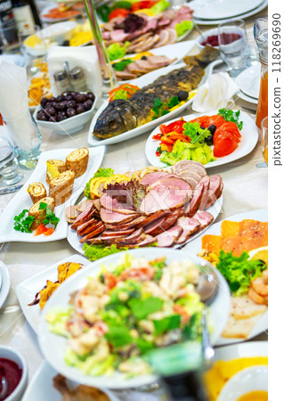 A Colorful Spread of Delicious Dishes at a Festive Gathering in a Restaurant. 118269690