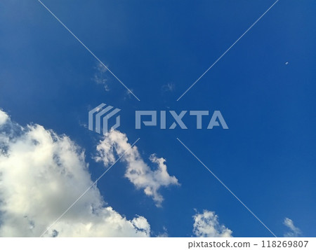 Horizontal shot of clouds in a clear blue sky Horizontal shot of clouds in a clear blue sky 118269807
