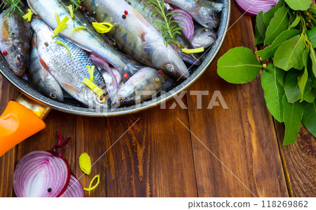 fresh fish perch in a saucepan with spices, top view. place for text fresh fish perch in a saucepan with spices, top view. place for text 118269862