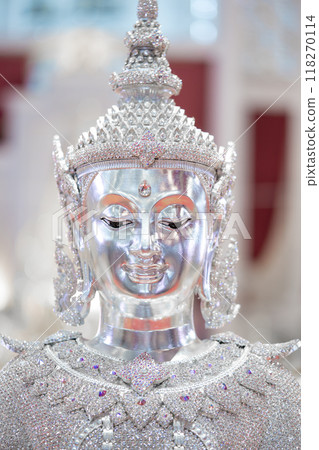 Close up to the Asia antique brightness and glitter Buddha statue inside Thailand Temple. 118270114