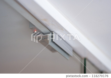 An electromagnetic lock, a maglock or electromagnet lock, is a type of locking device that uses an electromagnet to secure a door in place. It is often mounted on glass doors. 118270176