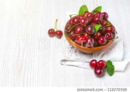 Cherry, Cherry in a clay plate on the table Cherry, Cherry in a clay plate on the table 118270306