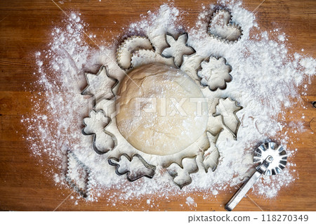 forms for squeezing the dough. dough on the table with dough tools. 118270349