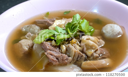 delicious beef stew with entrails and meatballs are decorated by green vegetable. Close up with studio light. 118270500
