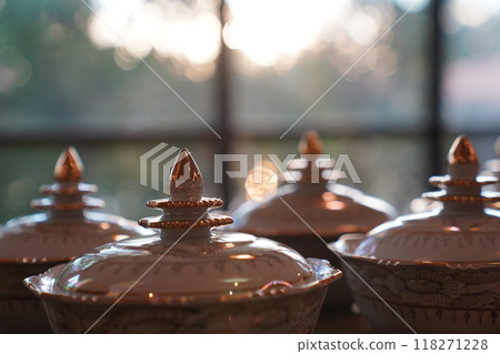 Thai bowl set on table prepare for give food offerings to a Buddhist monk in the morning. People usually prepare rice, dishes and flower offer food to monk. Thai bowl set on table prepare for give food offerings to a Buddhist monk in the morning. People usually prepare rice, dishes and flower offer food to monk. 118271228
