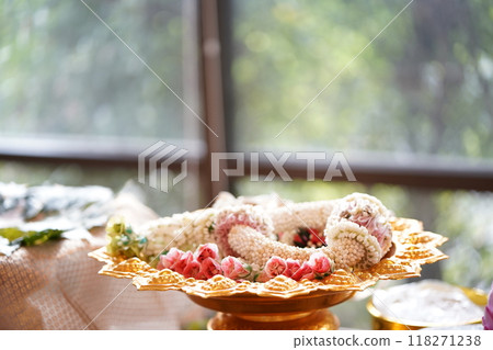 Portrait of jasmine and rose garland top golden tray. Jasmine garland is a handicraft that often used for events. 118271238