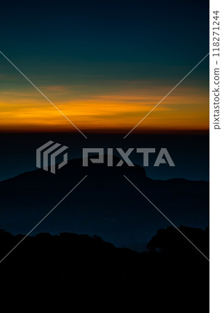 The beautiful sunrise at Doi intanon national park, Chiang Mai in the morning.Sun is rising from the hill to shy with beautiful yellow orange light. 118271244