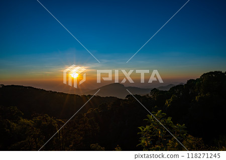 The beautiful sunrise at Doi intanon national park, Chiang Mai in the morning.Sun is rising from the hill to shy with beautiful yellow orange light. 118271245