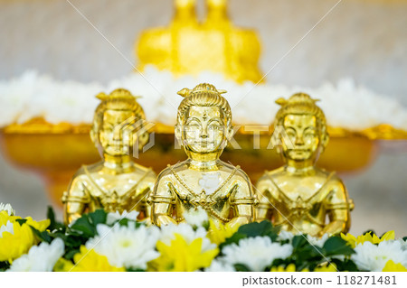 Portrait of three Golden boy Kumanthong top altar with flower. Kumanthong is be soul of a boy and superstition. 118271481