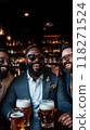 Group of men of different nationalities, dressed in stylish business suits, meeting at luxurious bar, relaxing with beer after work. 118271524