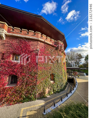 Autumn Ivy-Covered Building with Scenic Pathway 118272446