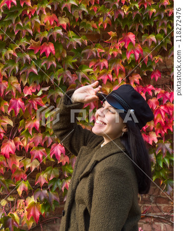 Stylish Woman in Autumn Foliage Stylish Woman in Autumn Foliage 118272476