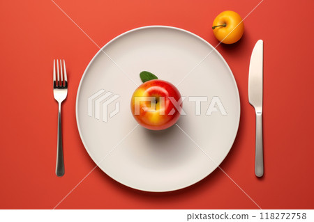 Minimalist food presentation with a fresh apple on a white plate Minimalist food presentation with a fresh apple on a white plate 118272758