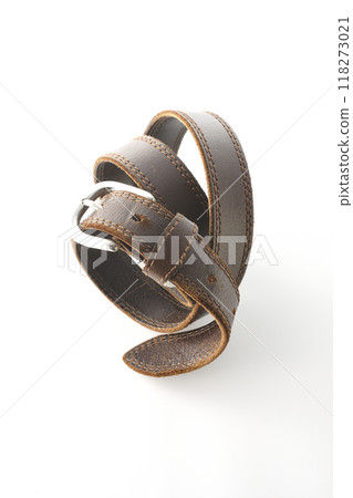 Brown belt photographed on a white background Brown belt photographed on a white background 118273021
