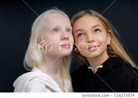 two good looking girls dreaming looking up 118273074