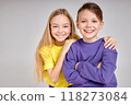 Happy kids are standing together at sudio 118273084