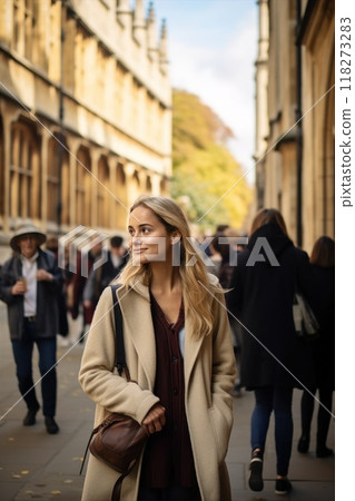A young woman strolls through a lively city street with stunning historic architecture 118273283