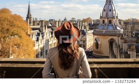 A young woman strolls through a lively city street with stunning historic architecture 118273284