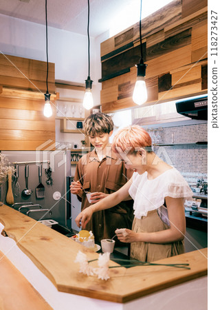 Couple making a cake in the kitchen 118273427