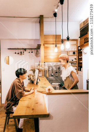 Couple making a cake in the kitchen Couple making a cake in the kitchen 118273439