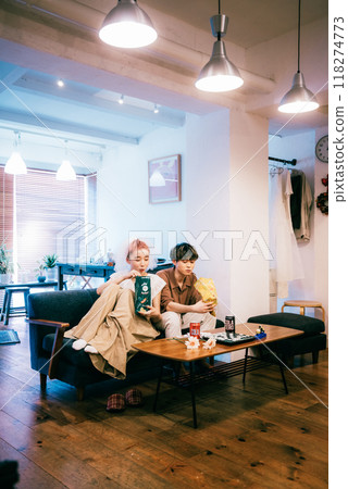 Bride and groom having a home party 118274773