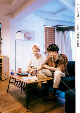 Bride and groom having a home party 118274804