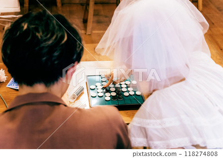 Bride and groom having a home party 118274808