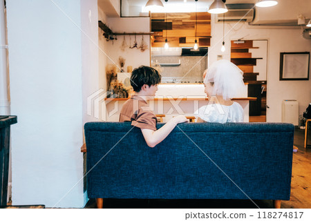 Bride and groom having a home party 118274817