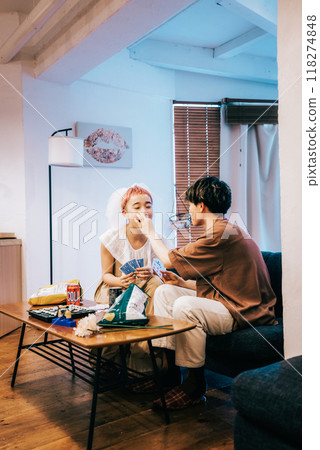 Bride and groom having a home party 118274848