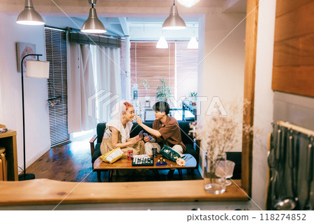 Bride and groom having a home party 118274852